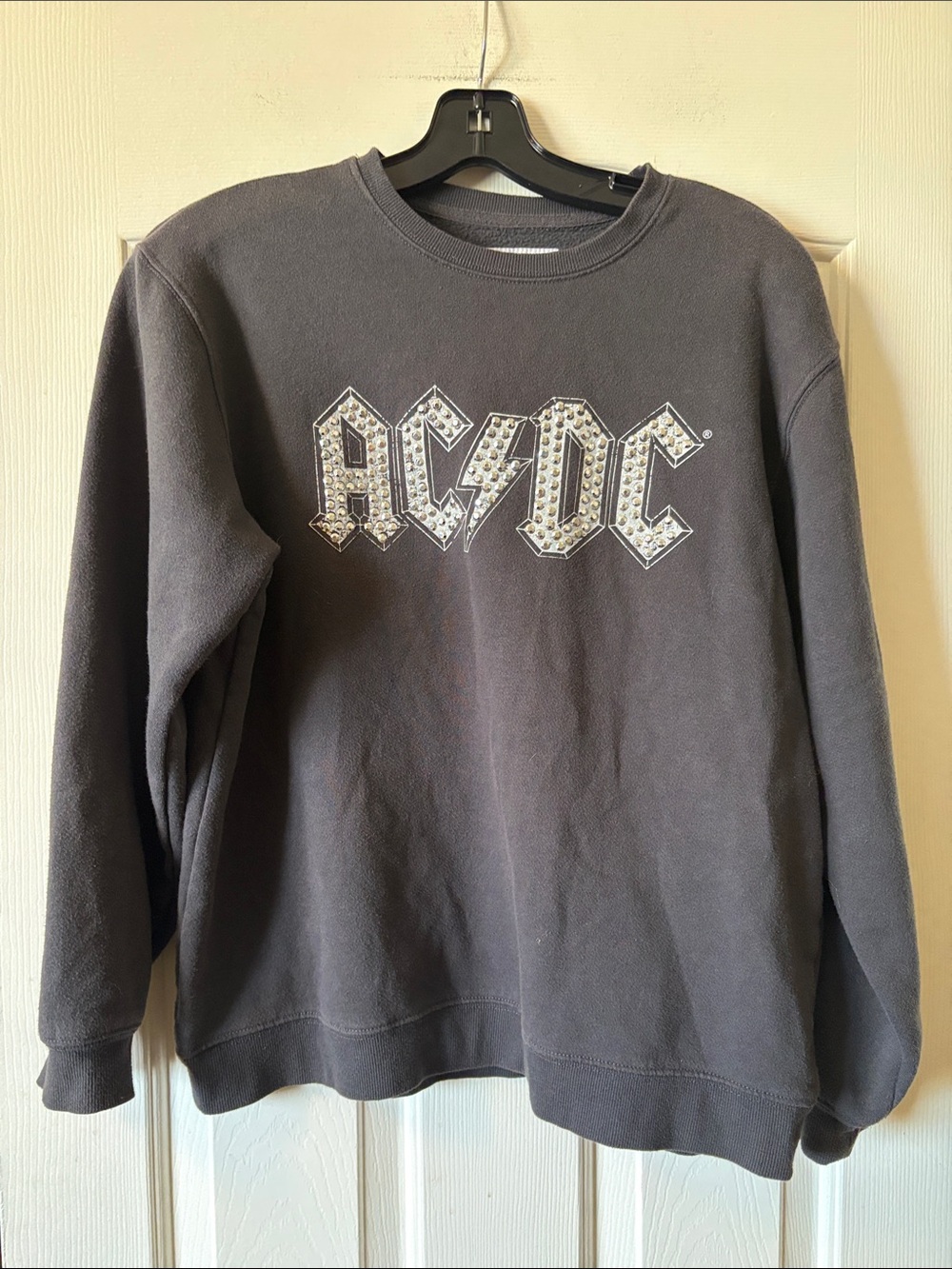 The Vinyl Icons AC/DC logo with silver rivets size S